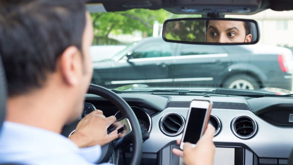 Driver Distracted By A Smartphone While Driving