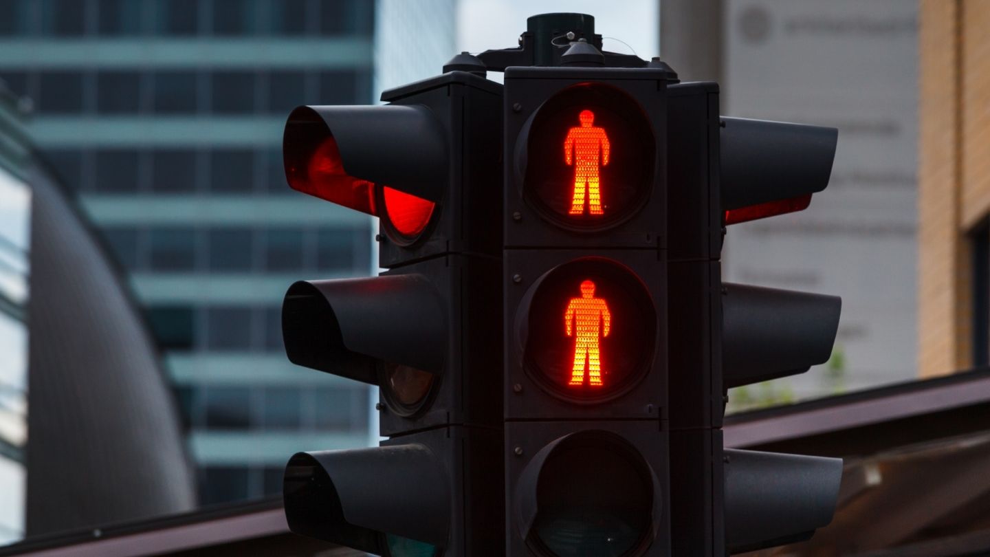 Red Pedestrian Signal At A Traffic Light
